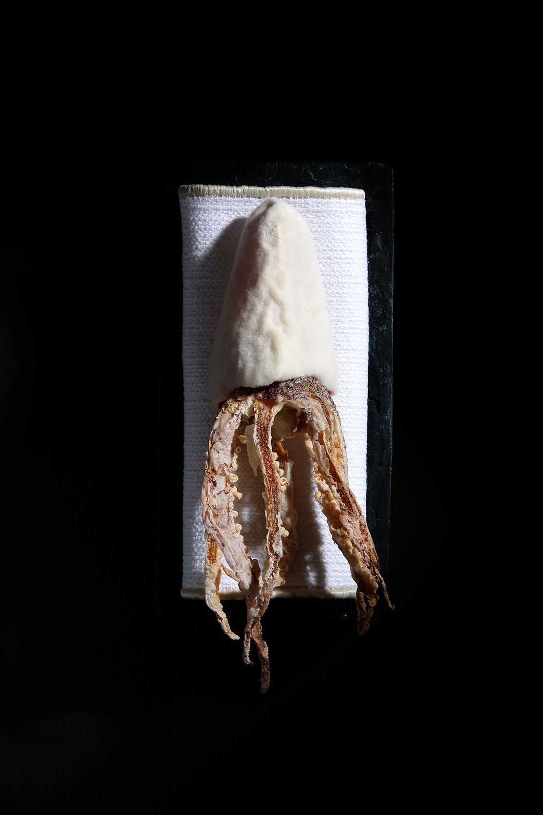 It looks like a squid, but is it? Try it... Delta Restaurant, two Stars Michelin, one Green Star
