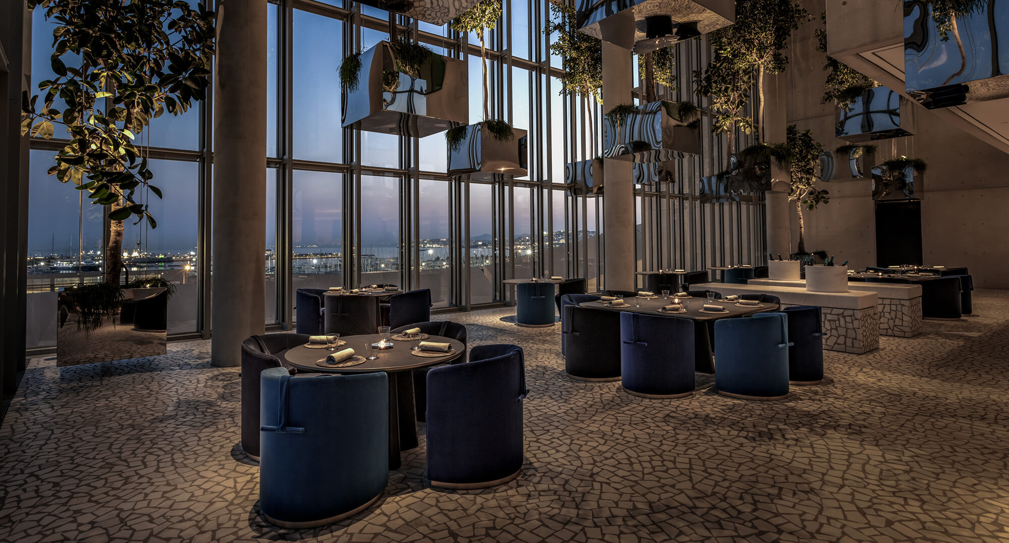 interior modern decor and tables for dinner at Delta restaurant. Delta, is a fine-dining restaurant, featuring contemporary Greek cuisine, opened its doors by Dipnosofistirion.